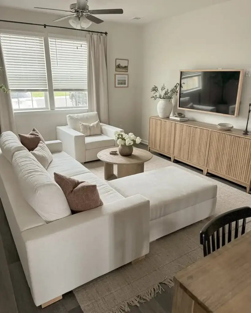 a small living room with foldable and stackable furniture